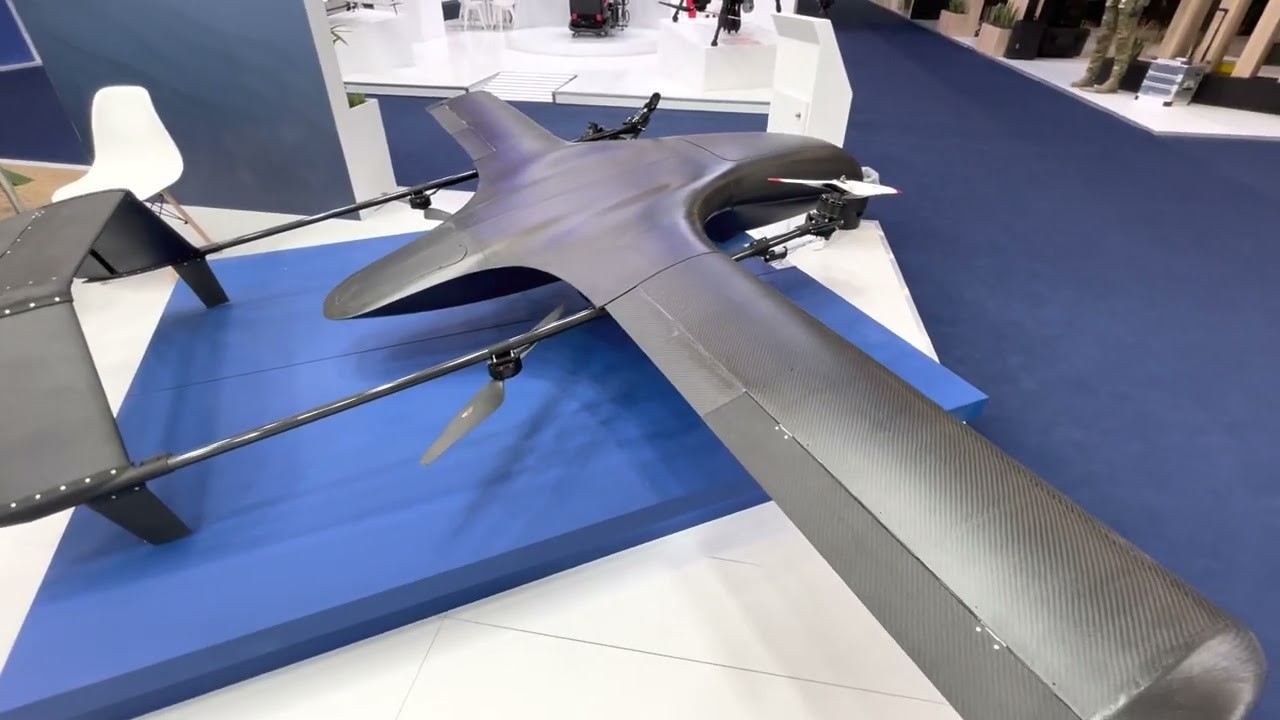 AETHER UAV wing and tilt-rotor detail on an exhibition stand